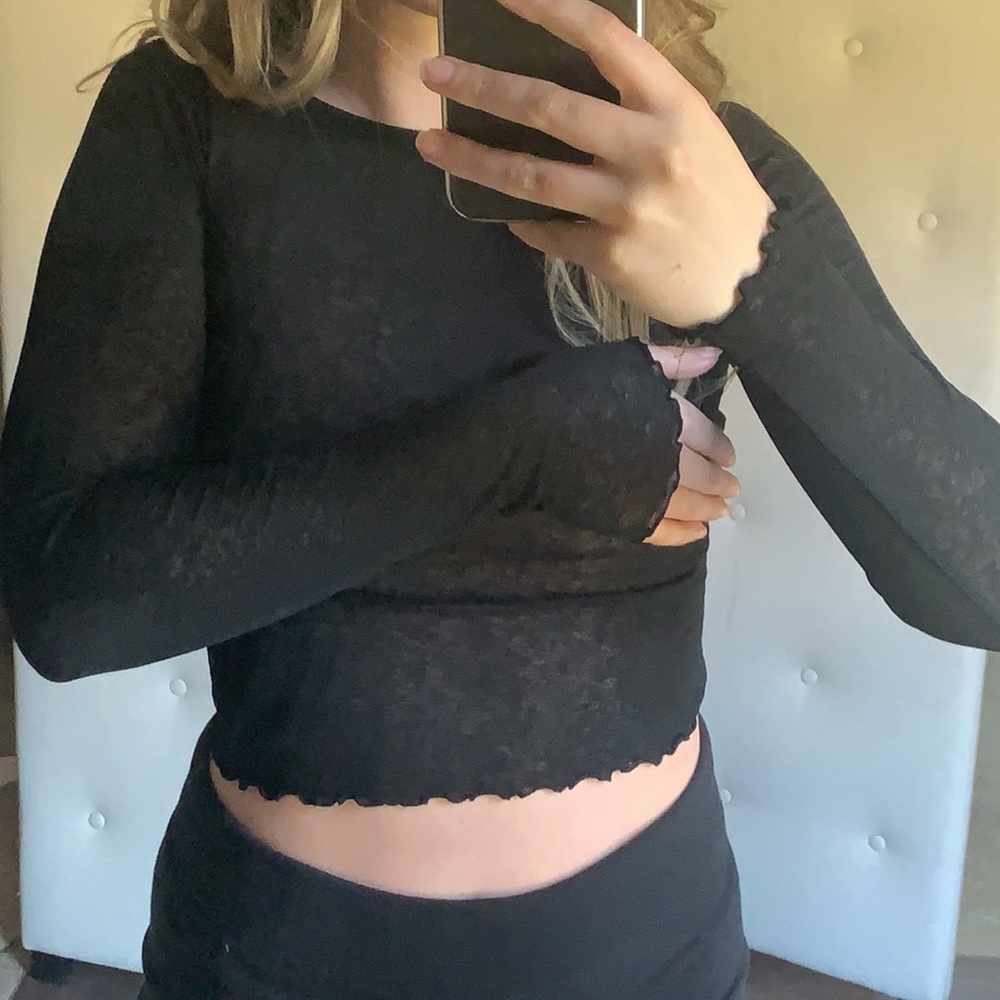 Semi sheer black long sleeve top w lettuce hems